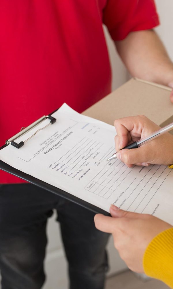 woman-signing-delivery-paper